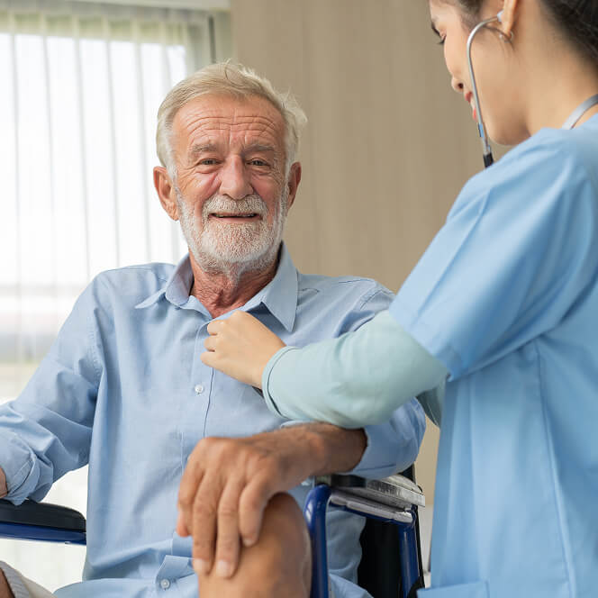 Caregiver Comforting Resident at Assisted Living Facility